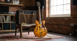 Ibanez Artcore series semi-hollow electric guitar positioned next to a valve amplifier for warm jazz sounds