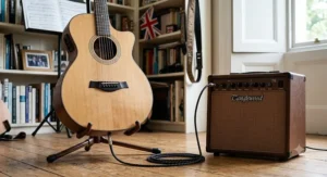 An electro acoustic guitar plugged into a dedicated acoustic amplifier with a standard jack lead.